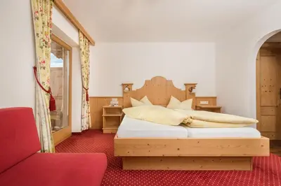 Ein Bett oder Betten in einem Zimmer der Unterkunft Alpenkönig