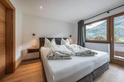 Ein Bett oder Betten in einem Zimmer der Unterkunft Apart Huamatgfühl