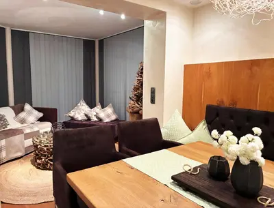 Ein Bett oder Betten in einem Zimmer der Unterkunft KOSIS Townhouse mit Spa Zugang im KOSIS Sports Lifestyle Hotel