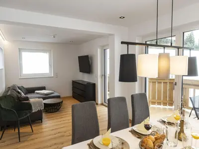 Ein Sitzbereich in der Unterkunft Alpine apartment with view & garden