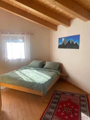 Ein Bett oder Betten in einem Zimmer der Unterkunft Ferienwohnung im Herzen Tirols