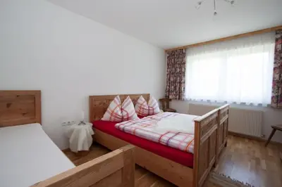 Ein Bett oder Betten in einem Zimmer der Unterkunft Stollenberghütte