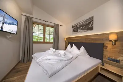 Ein Bett oder Betten in einem Zimmer der Unterkunft Trattenbach Chalet Bärenbadkogel