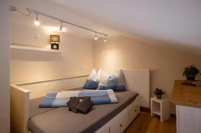 Ein Bett oder Betten in einem Zimmer der Unterkunft 4-Jahreszeiten