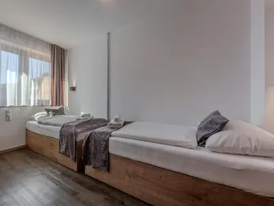 Ein Bett oder Betten in einem Zimmer der Unterkunft Holiday apartment directly on the ski slope