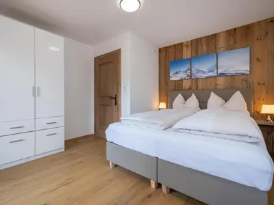 Ein Bett oder Betten in einem Zimmer der Unterkunft Brügglbach XL