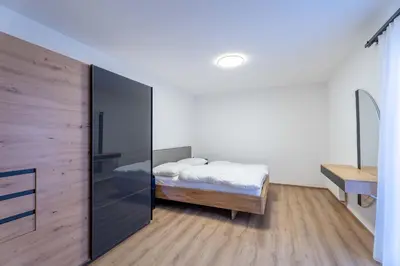 Ein Bett oder Betten in einem Zimmer der Unterkunft Alpenglück Apartments by we rent, JOKERCARD INCLUDED