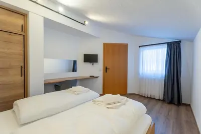 Ein Bett oder Betten in einem Zimmer der Unterkunft Alpenglück Apartments by we rent, JOKERCARD INCLUDED