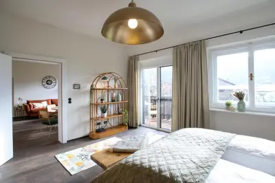 Ein Bett oder Betten in einem Zimmer der Unterkunft Strumpfburg by Alpenglück Apartments