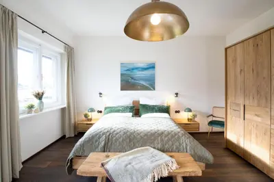 Ein Bett oder Betten in einem Zimmer der Unterkunft Strumpfburg by Alpenglück Apartments