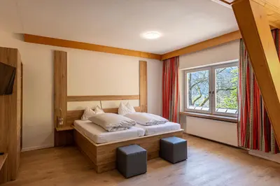 Ein Bett oder Betten in einem Zimmer der Unterkunft Gasthof Stimmersee