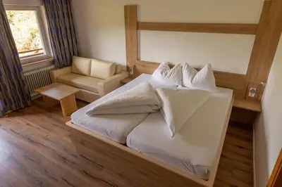 Ein Bett oder Betten in einem Zimmer der Unterkunft Gasthof Stimmersee