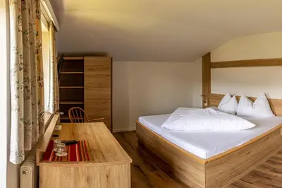 Ein Bett oder Betten in einem Zimmer der Unterkunft Gasthof Stimmersee