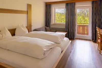 Ein Bett oder Betten in einem Zimmer der Unterkunft Gasthof Stimmersee