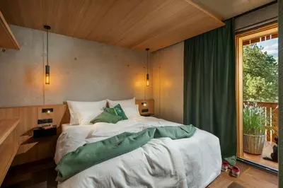 Ein Bett oder Betten in einem Zimmer der Unterkunft bläkat