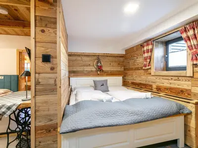 Ein Bett oder Betten in einem Zimmer der Unterkunft Almversteck Hollersbach