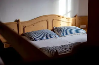 Ein Bett oder Betten in einem Zimmer der Unterkunft Hecherhaus