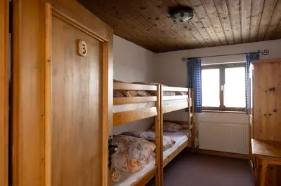 Ein Bett oder Betten in einem Zimmer der Unterkunft Hecherhaus