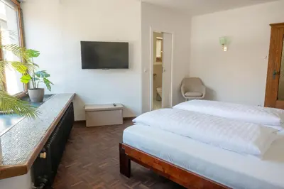 Ein Bett oder Betten in einem Zimmer der Unterkunft Hornweg Suites