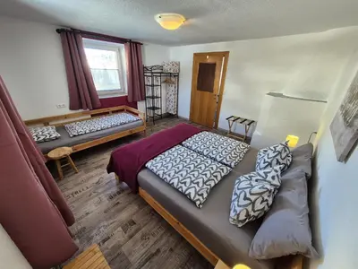 Ein Bett oder Betten in einem Zimmer der Unterkunft Ferienwohnung Neuheim