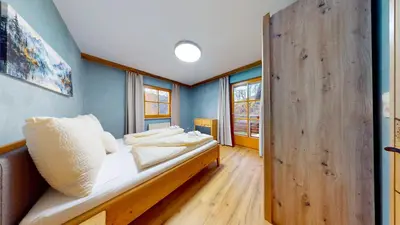 Ein Bett oder Betten in einem Zimmer der Unterkunft Chalet Wasserfall 52 mit Sauna