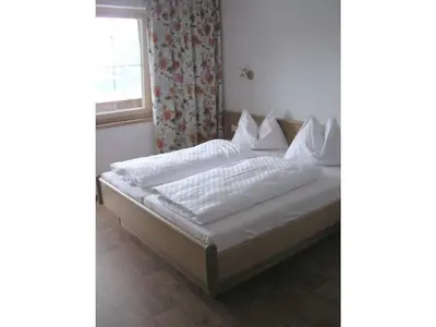 Ein Bett oder Betten in einem Zimmer der Unterkunft Rettenstein- Berghof Luegeck