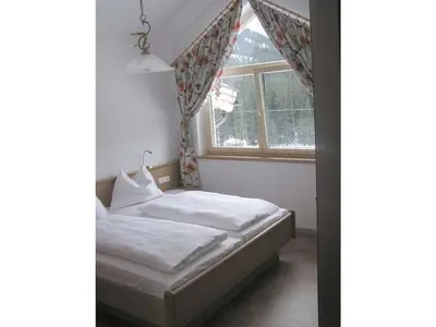 Ein Bett oder Betten in einem Zimmer der Unterkunft Wildkogel - Berghof Luegeck
