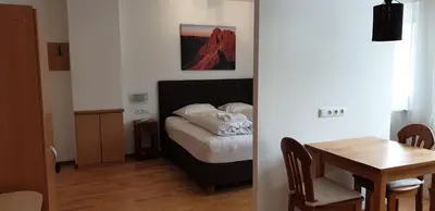 Ein Bett oder Betten in einem Zimmer der Unterkunft Alpenjuwel by PiaundDirk