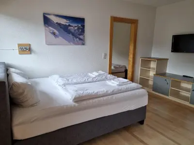 Ein Bett oder Betten in einem Zimmer der Unterkunft Alpenjuwel by PiaundDirk