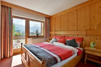 Ein Bett oder Betten in einem Zimmer der Unterkunft Appartementhaus Kaltenbach-Stumm by PiaundDirk