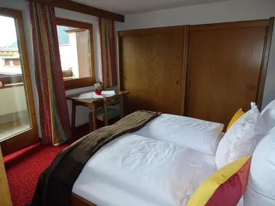 Ein Bett oder Betten in einem Zimmer der Unterkunft Appartementhaus Kaltenbach-Stumm by PiaundDirk