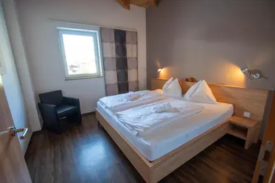 Ein Bett oder Betten in einem Zimmer der Unterkunft Apartments am Bärenkopf