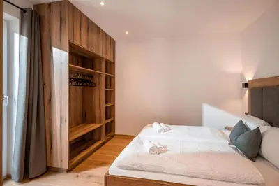 Ein Bett oder Betten in einem Zimmer der Unterkunft KitzAlp Apart