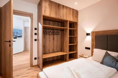Ein Bett oder Betten in einem Zimmer der Unterkunft KitzAlp Apart