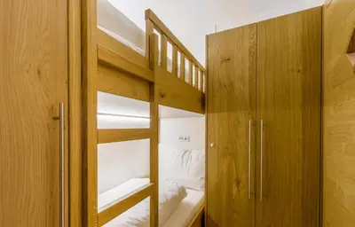 Ein Bett oder Betten in einem Zimmer der Unterkunft Bolodges Apartments by Alpin Rentals