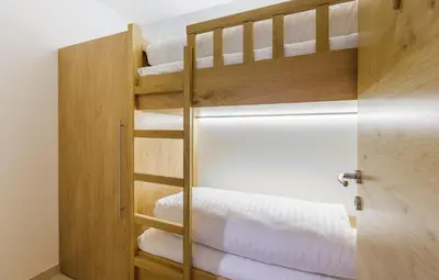 Ein Bett oder Betten in einem Zimmer der Unterkunft Bolodges Apartments by Alpin Rentals