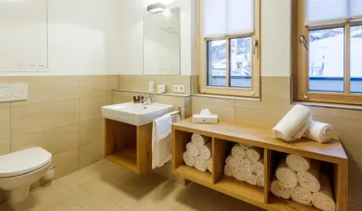 Ein Badezimmer in der Unterkunft Bolodges Apartments by Alpin Rentals