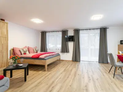 Ein Bett oder Betten in einem Zimmer der Unterkunft Tennerhof Apartments Top 1 und Top 2