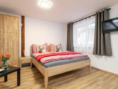 Ein Bett oder Betten in einem Zimmer der Unterkunft Tennerhof Apartments Top 1
