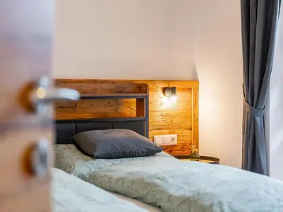 Ein Bett oder Betten in einem Zimmer der Unterkunft Tauernapart I und II