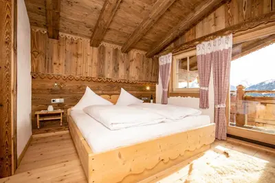 Ein Bett oder Betten in einem Zimmer der Unterkunft Ferienhütte Alpenherz