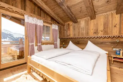 Ein Bett oder Betten in einem Zimmer der Unterkunft Ferienhütte Alpenherz