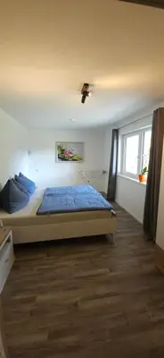 Ein Bett oder Betten in einem Zimmer der Unterkunft Ferienwohnung zum Guffertblick