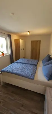 Ein Bett oder Betten in einem Zimmer der Unterkunft Ferienwohnung zum Guffertblick