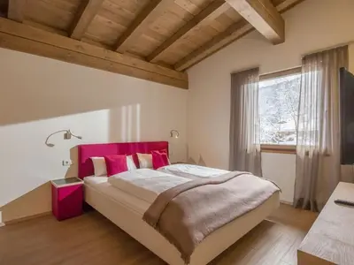 Ein Bett oder Betten in einem Zimmer der Unterkunft Resort Tirol Wildschönau