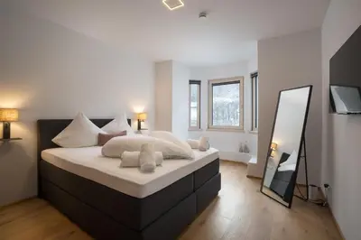 Ein Bett oder Betten in einem Zimmer der Unterkunft House4U