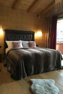 Ein Bett oder Betten in einem Zimmer der Unterkunft Holiday Home Chalet Tannweg in Sankt Johann in Tirol by Interhome