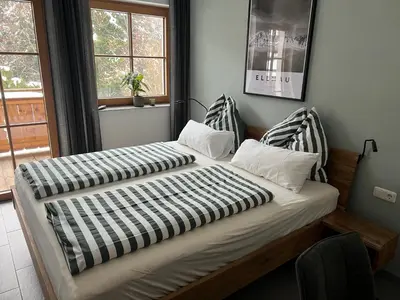 Ein Bett oder Betten in einem Zimmer der Unterkunft Ferienwohnung Jaspis - Scheffau am Wilden Kaiser