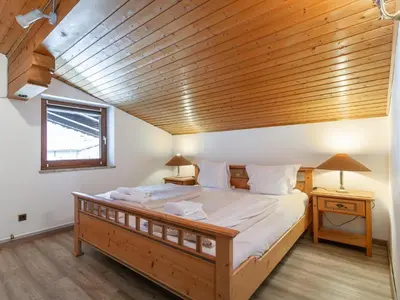 Ein Bett oder Betten in einem Zimmer der Unterkunft FamilienLodge Reith