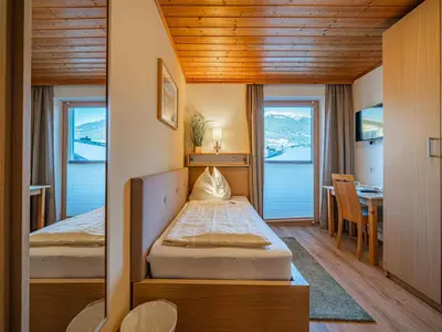 Ein Bett oder Betten in einem Zimmer der Unterkunft Mühlhof